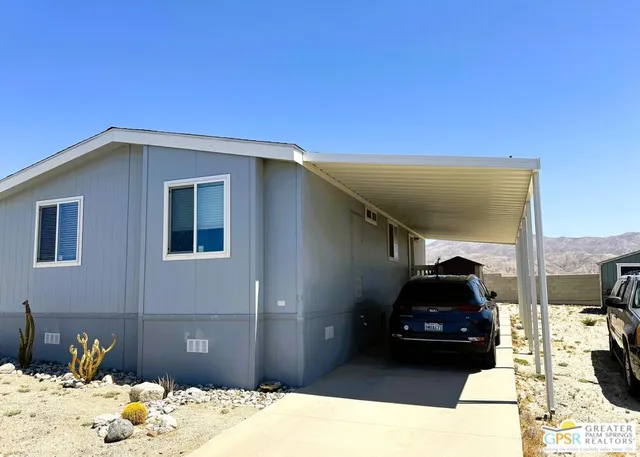 a kitchen with a refrigerator and a stove top oven