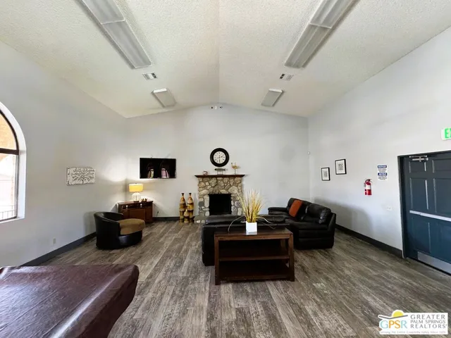 a spacious bathroom with a sink a toilet a mirror and a tub