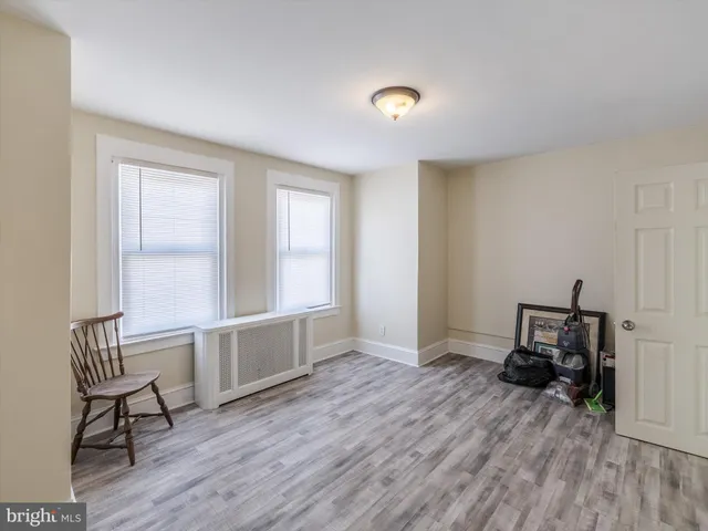 a view of workspace with wooden floor and chair