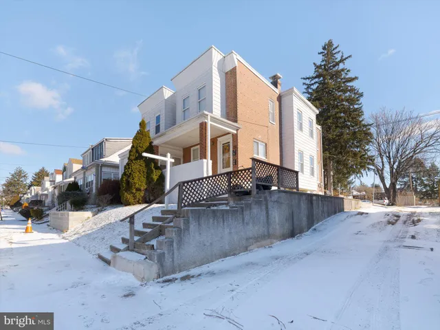 a view of a street with a house