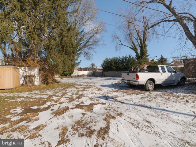 a view of street with parked cars