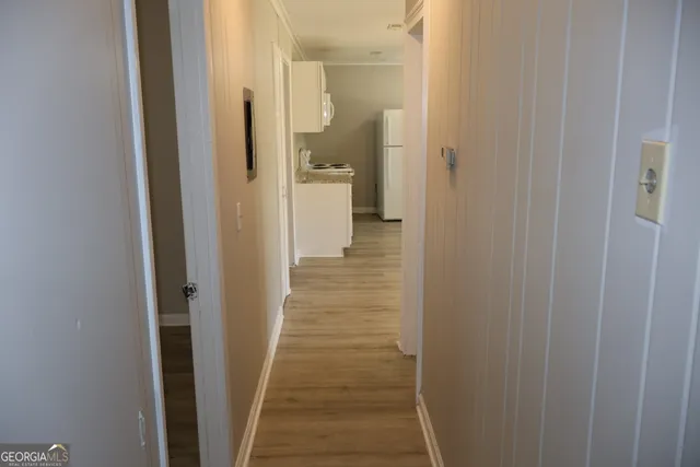 a view of a bathroom from the hallway