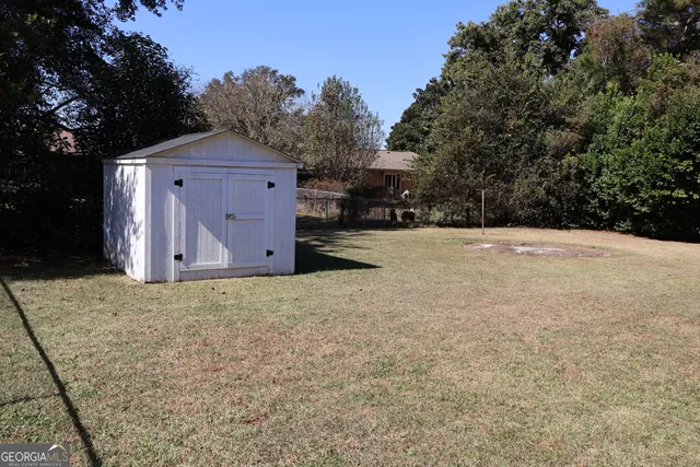 a wooden house with a outdoor space