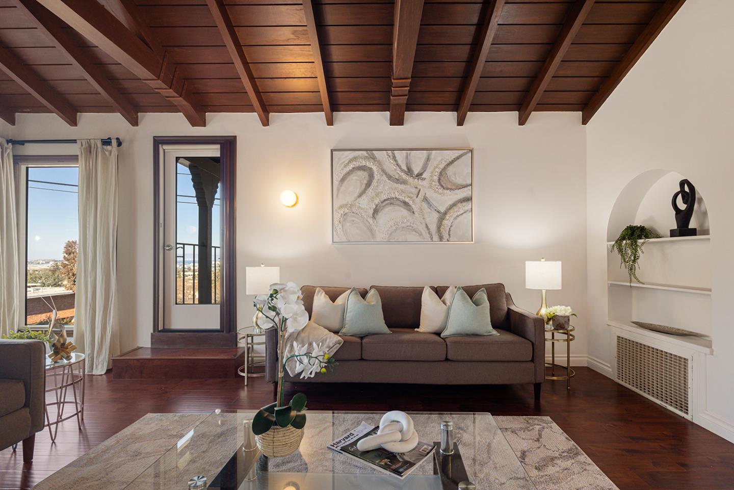 943 Hillcrest Boulevard Millbrae, CA 94030 - Photo 13 of 51 a living room with furniture and wooden floor