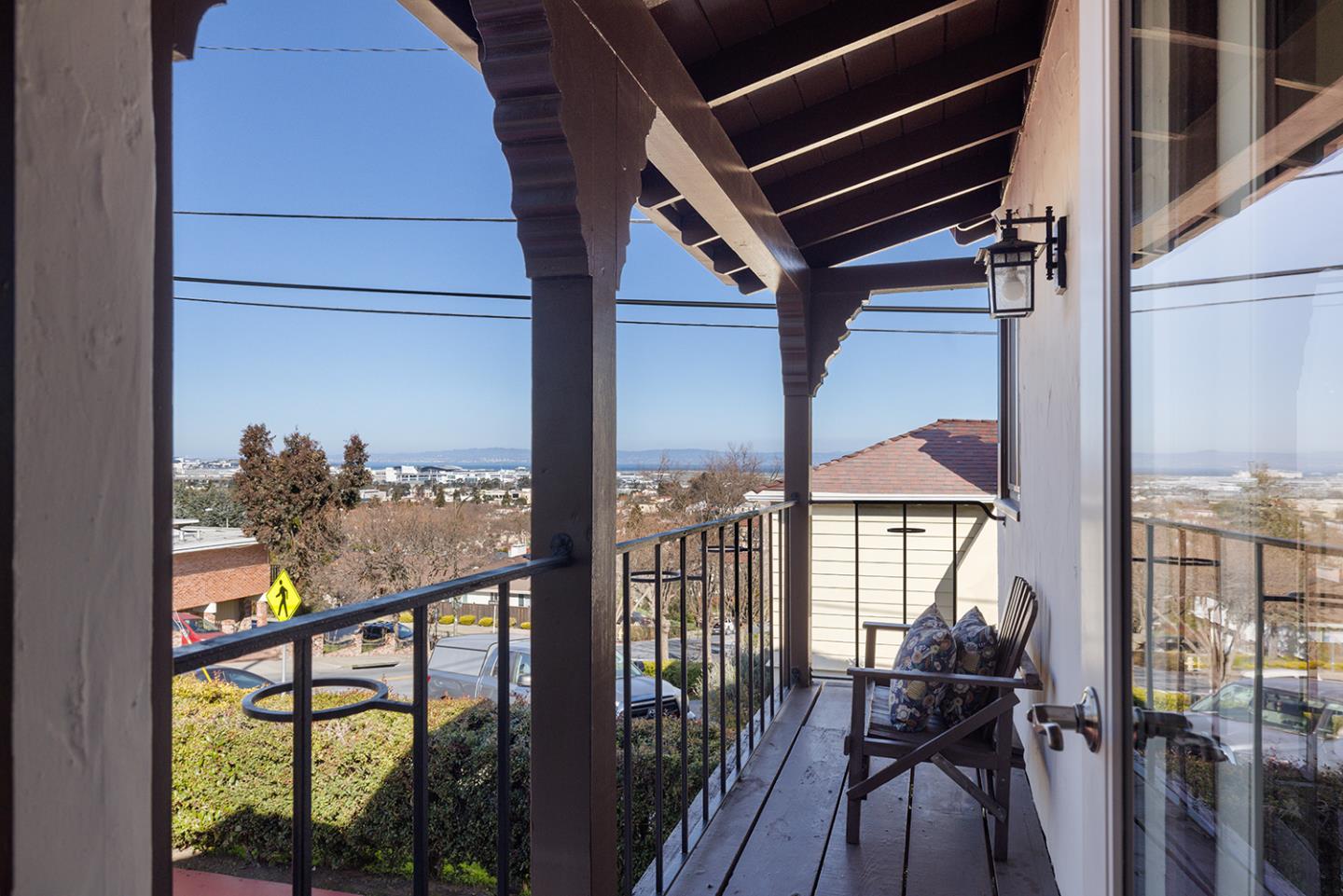 943 Hillcrest Boulevard Millbrae, CA 94030 - Photo 14 of 51 a view of a balcony with chairs and wooden floor