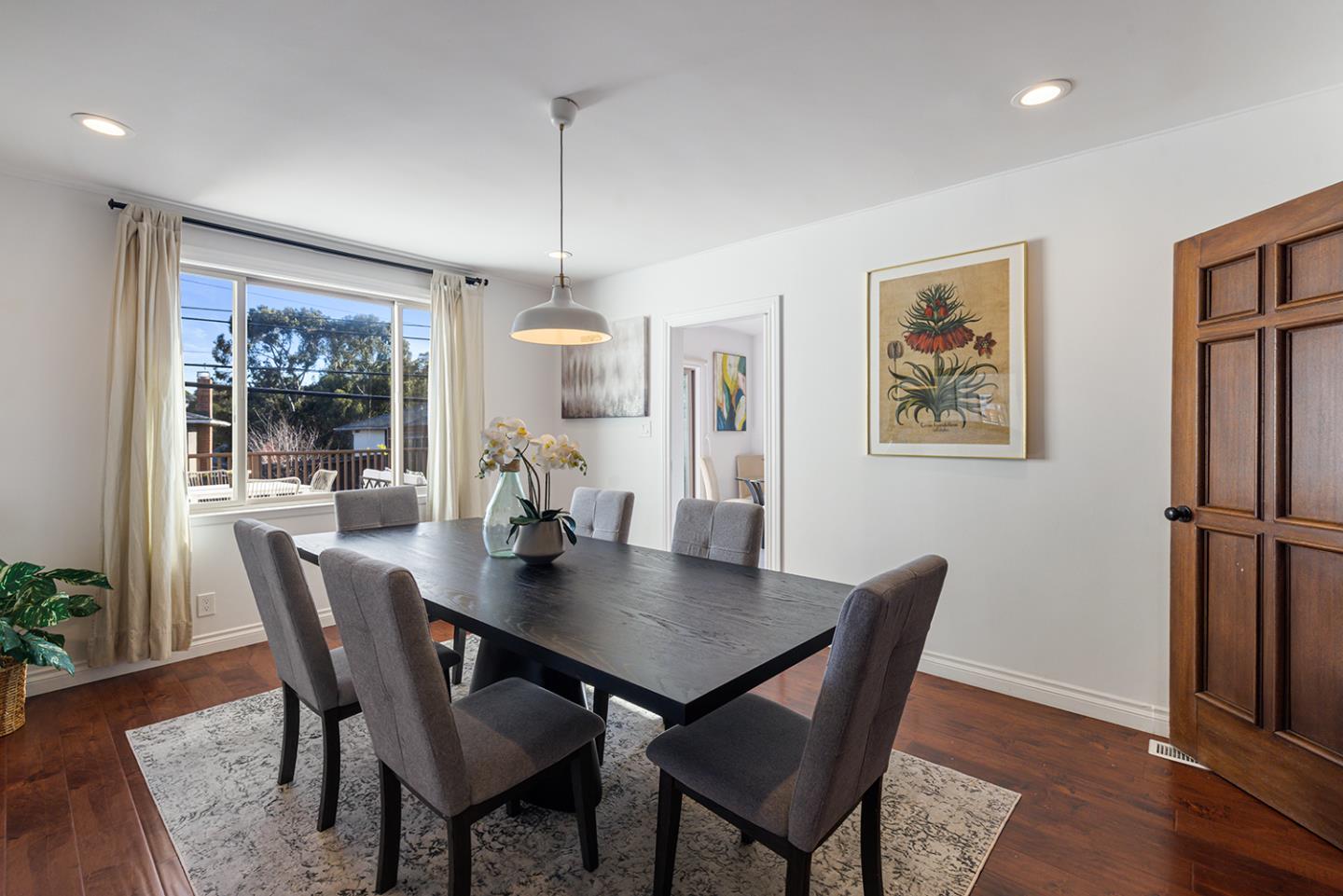 943 Hillcrest Boulevard Millbrae, CA 94030 - Photo 16 of 51 a view of a dining room with furniture window and wooden floor
