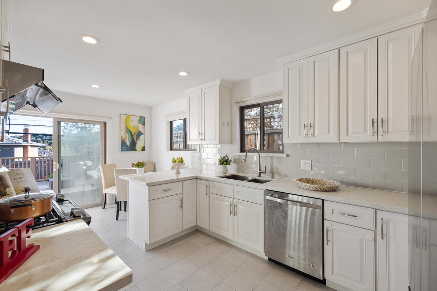 943 Hillcrest Boulevard Millbrae, CA 94030 - Photo 19 of 51 a kitchen that has a sink and a stove in it