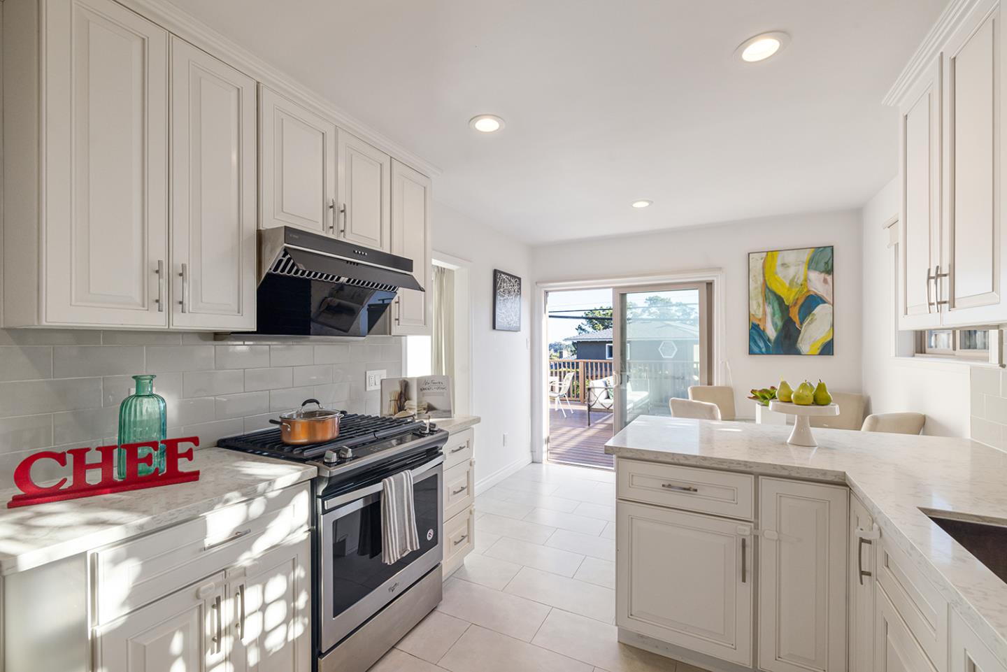 943 Hillcrest Boulevard Millbrae, CA 94030 - Photo 20 of 51 a kitchen with stainless steel appliances granite countertop a sink a stove and a refrigerator