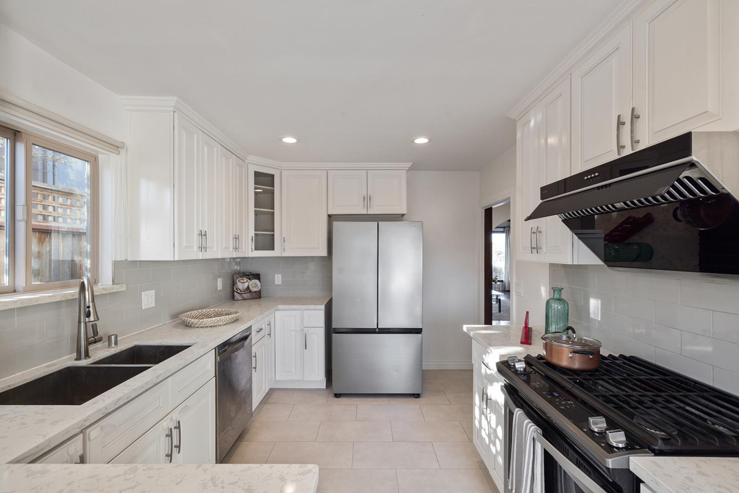 943 Hillcrest Boulevard Millbrae, CA 94030 - Photo 23 of 51 a kitchen with a sink stove and refrigerator