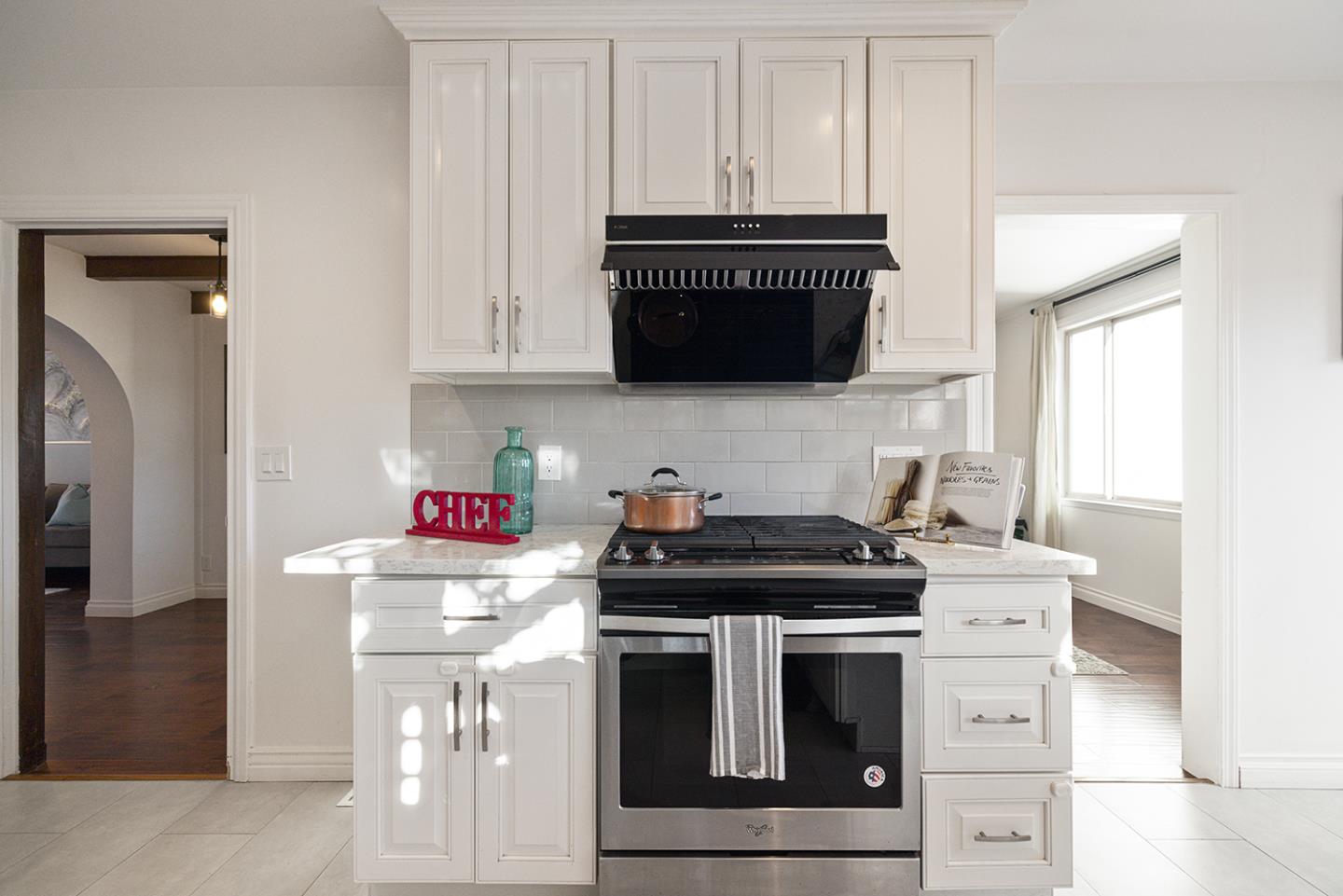 943 Hillcrest Boulevard Millbrae, CA 94030 - Photo 25 of 51 a kitchen with stainless steel appliances a stove and a microwave
