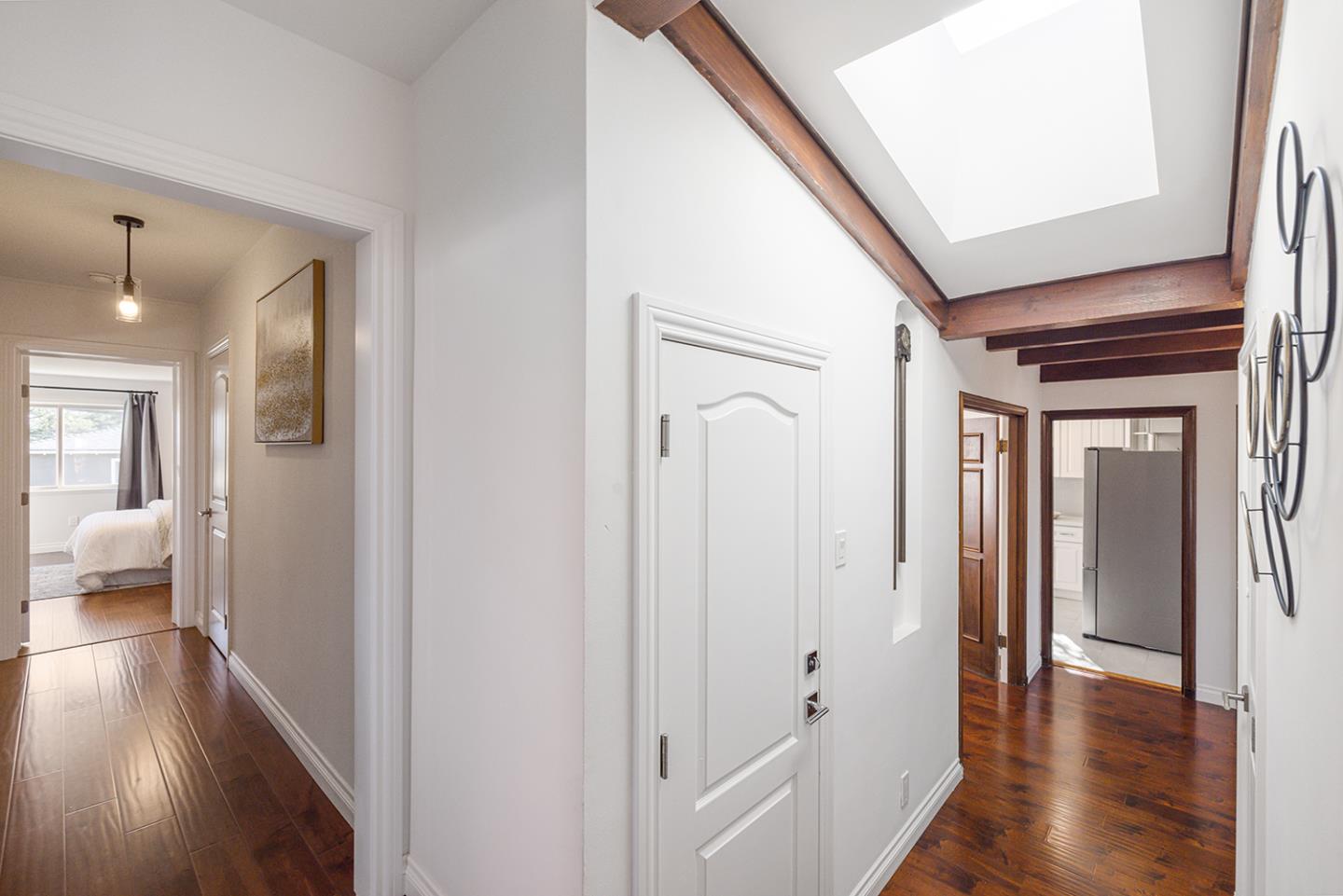 943 Hillcrest Boulevard Millbrae, CA 94030 - Photo 26 of 51 a view of a hallway with wooden floor and staircase