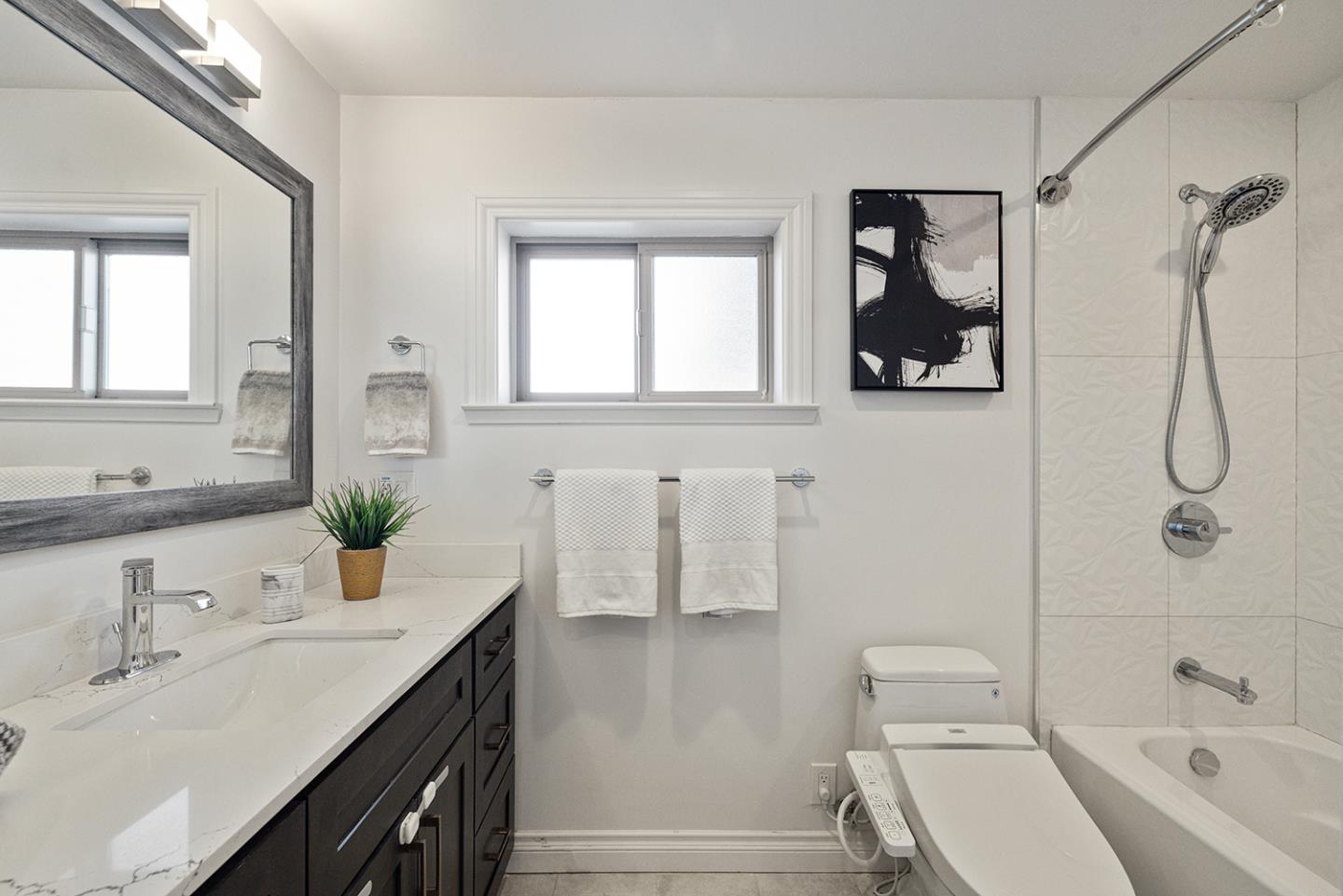 943 Hillcrest Boulevard Millbrae, CA 94030 - Photo 31 of 51 a bathroom with a sink a toilet and shower