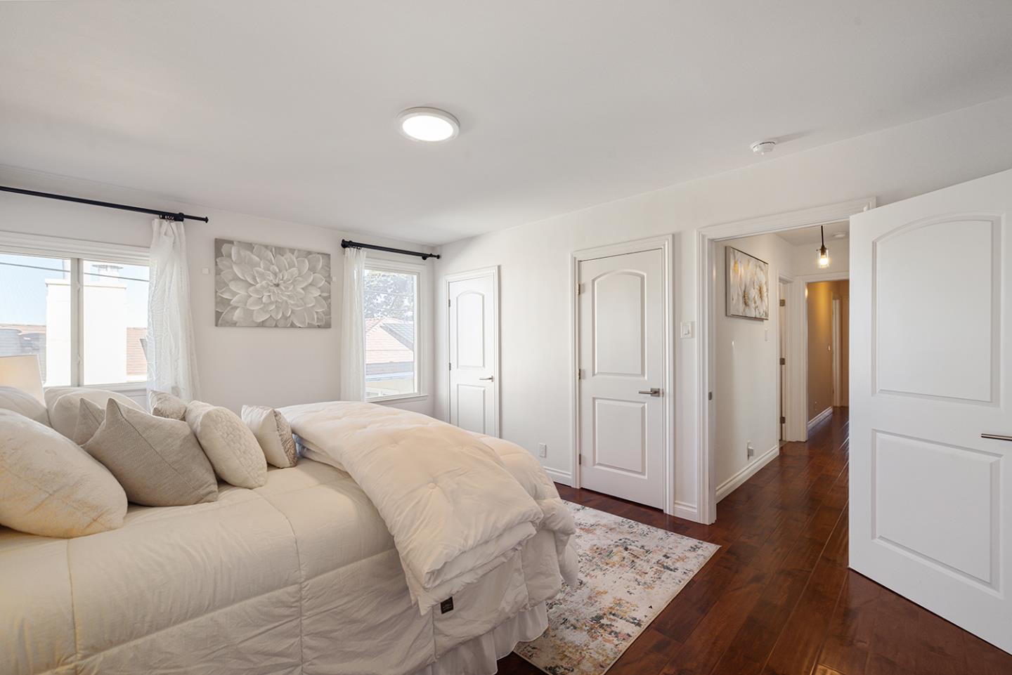 943 Hillcrest Boulevard Millbrae, CA 94030 - Photo 36 of 51 a spacious bedroom with a bed and a window