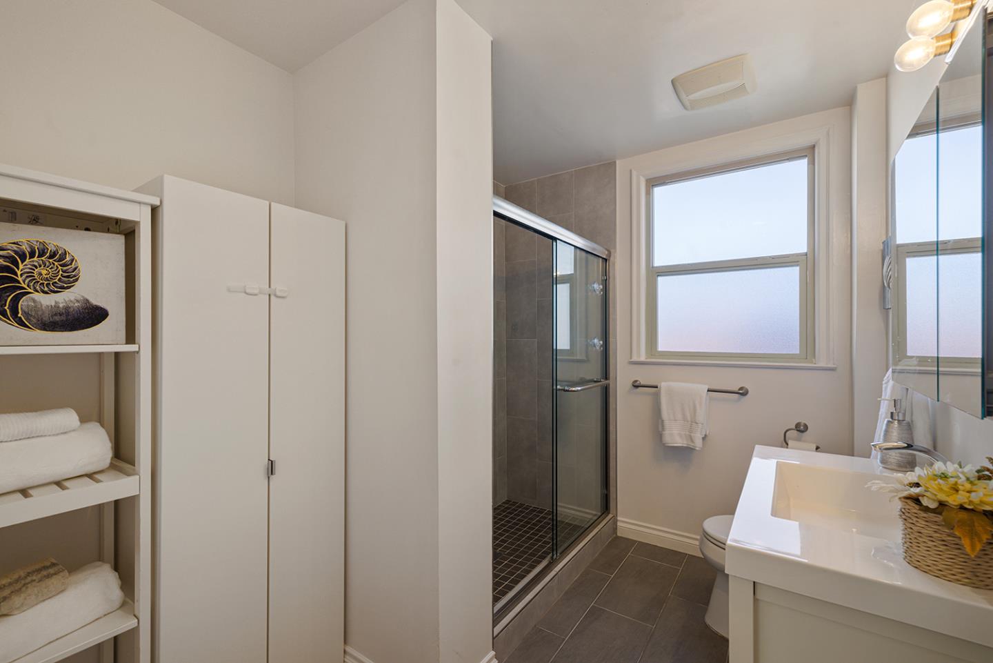 943 Hillcrest Boulevard Millbrae, CA 94030 - Photo 38 of 51 a bathroom with a sink toilet and shower