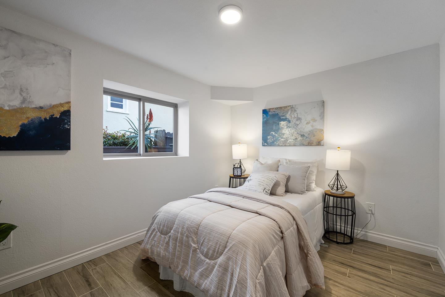 943 Hillcrest Boulevard Millbrae, CA 94030 - Photo 42 of 51 a bedroom with a bed and a flat screen tv