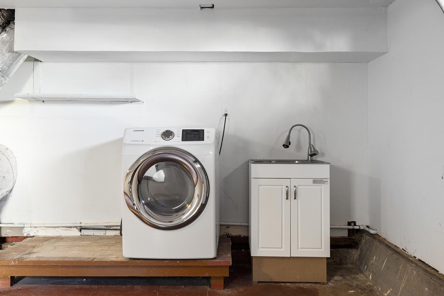943 Hillcrest Boulevard Millbrae, CA 94030 - Photo 45 of 51 a utility room with sink dryer and washer