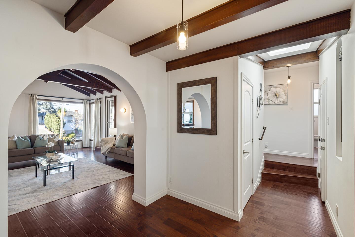 943 Hillcrest Boulevard Millbrae, CA 94030 - Photo 7 of 51 a living room with furniture and a fireplace