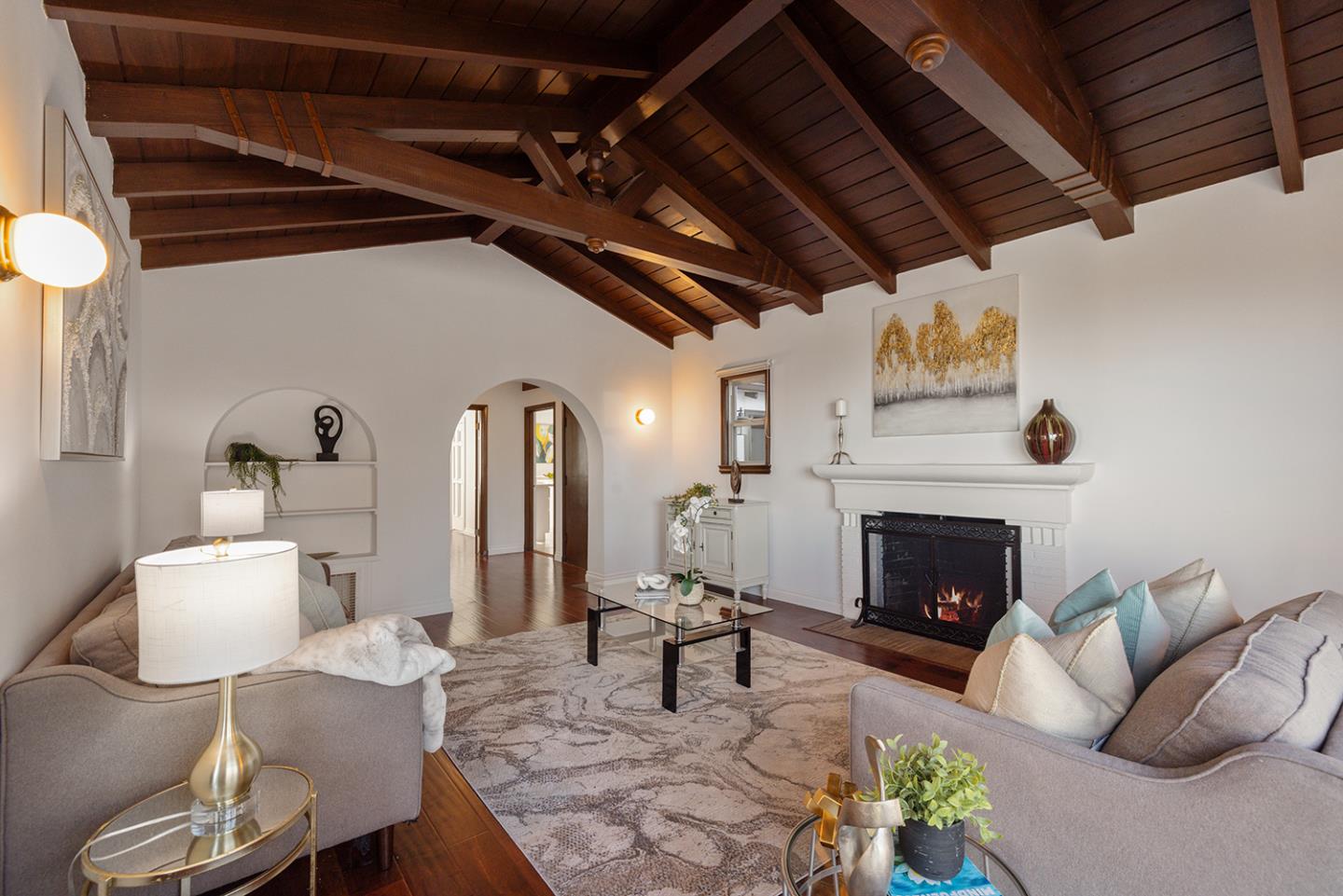 943 Hillcrest Boulevard Millbrae, CA 94030 - Photo 9 of 51 a living room with furniture and a fireplace