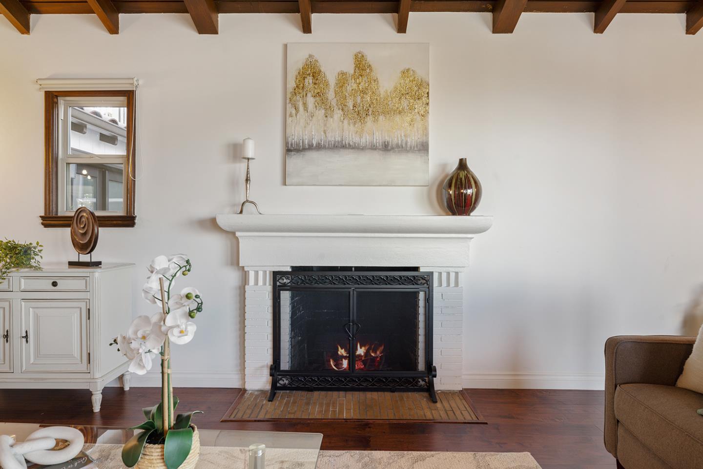 943 Hillcrest Boulevard Millbrae, CA 94030 - Photo 10 of 51 a living room with furniture and a fireplace