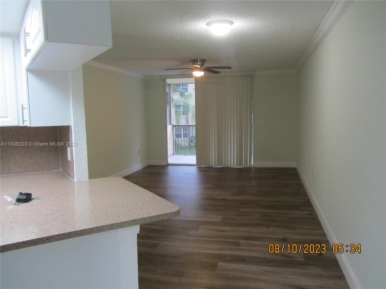 Doral Doral, FL 33166 - Photo 14 of 28 a view of a hallway with wooden floor
