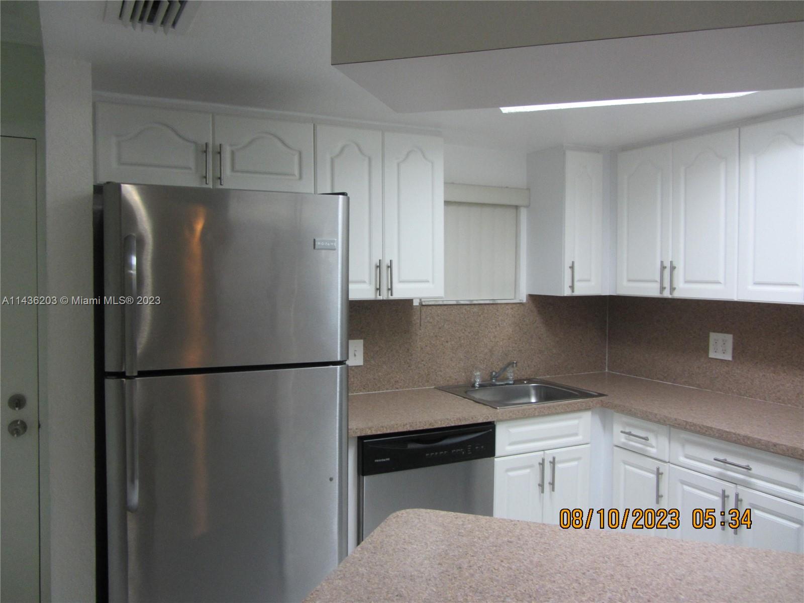 Doral Doral, FL 33166 - Photo 15 of 28 a white refrigerator freezer sitting in a kitchen