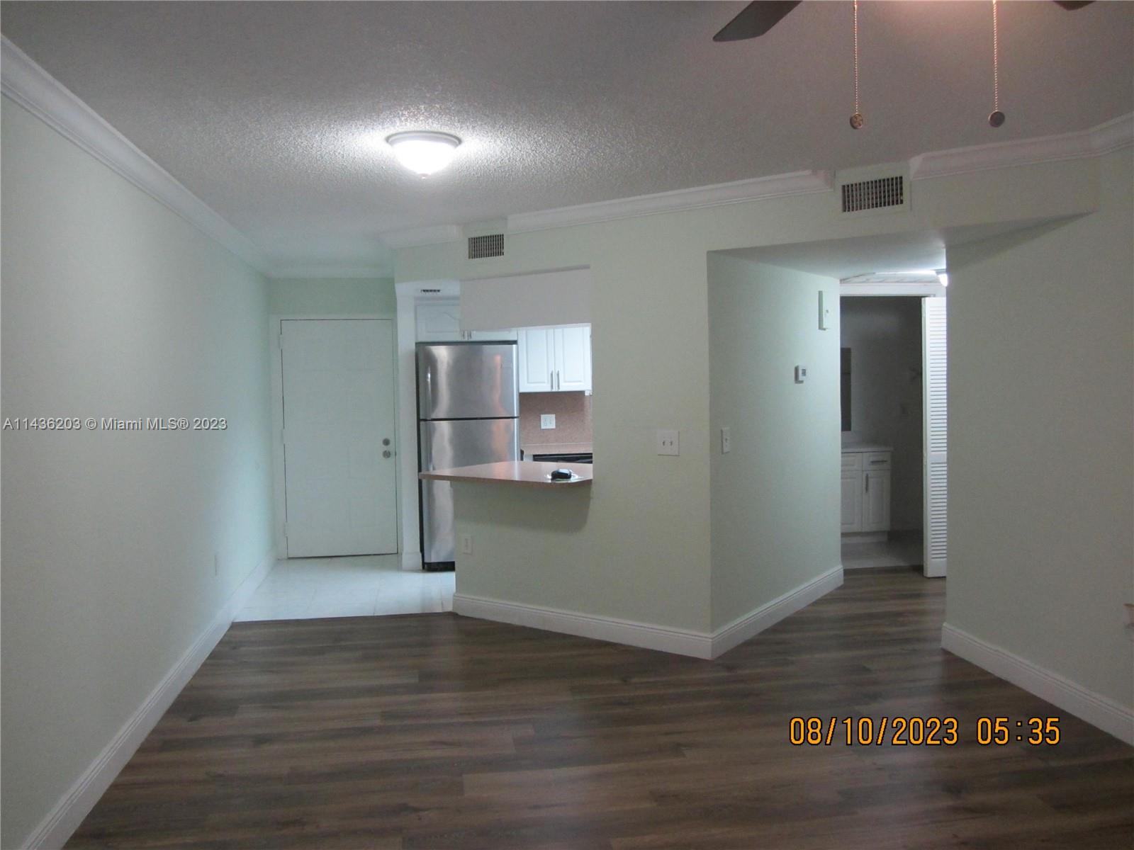 Doral Doral, FL 33166 - Photo 17 of 28 a view of a kitchen cabinets and wooden floor