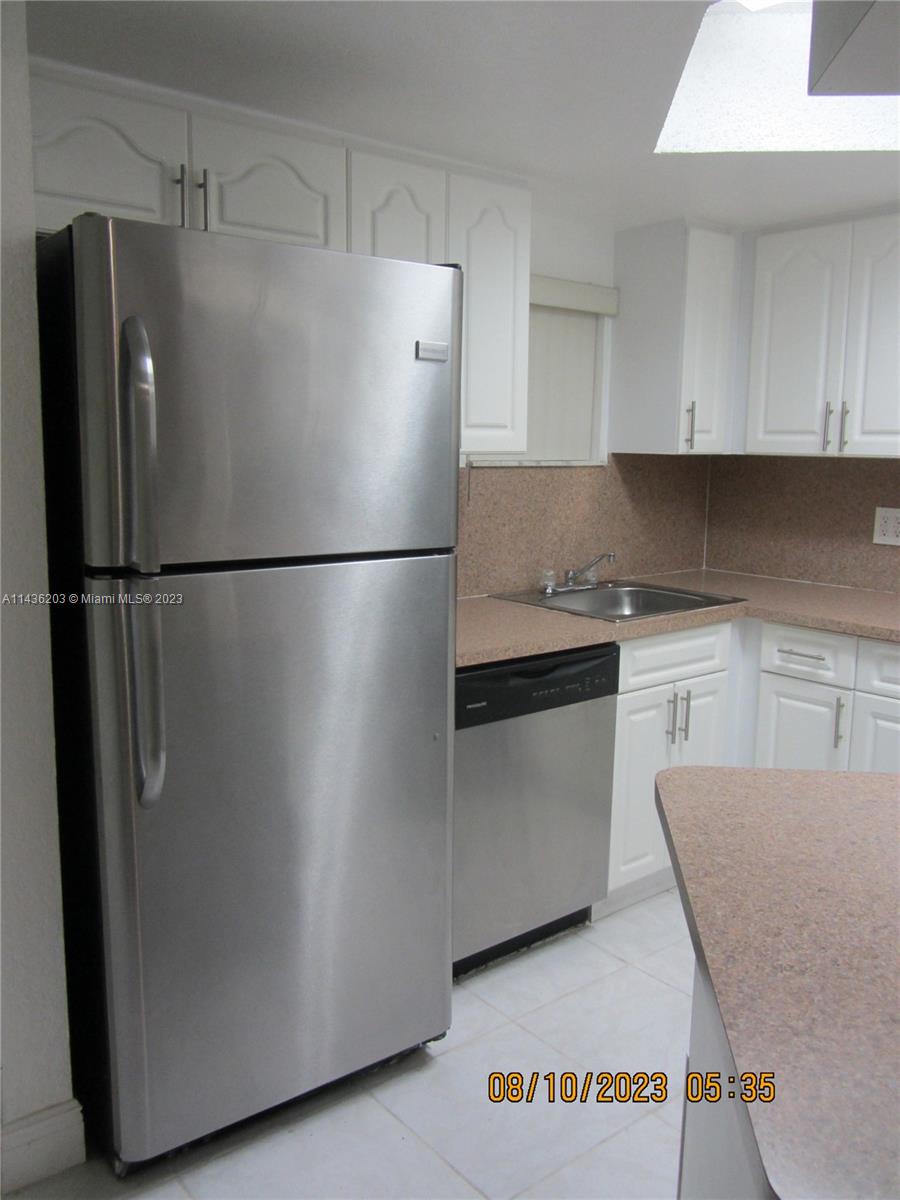 Doral Doral, FL 33166 - Photo 19 of 28 a white refrigerator freezer sitting in a kitchen