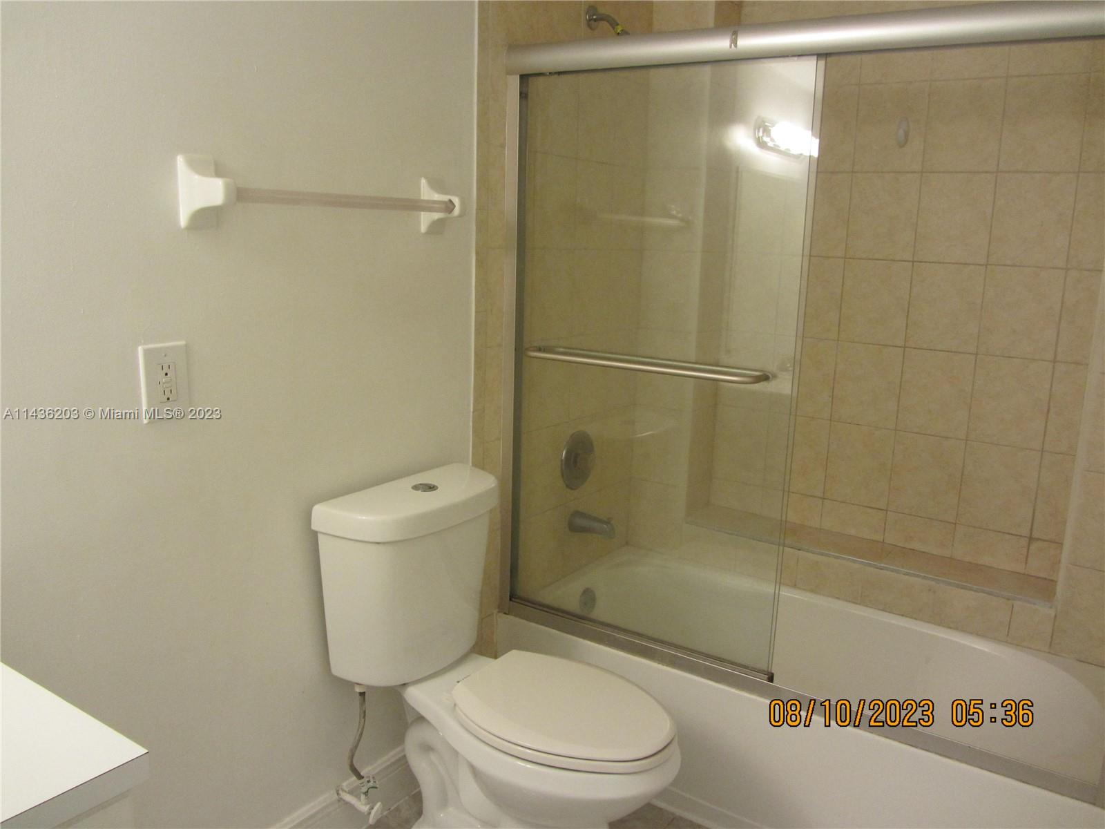 Doral Doral, FL 33166 - Photo 22 of 28 a bathroom with a toilet and a shower