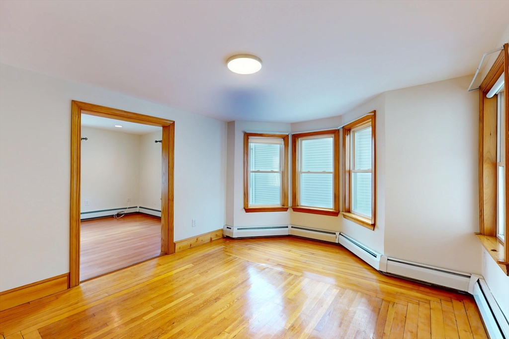 58 Teel Street, Unit 58 Arlington, MA 02474 - Photo 6 of 22 a view of an empty room and window