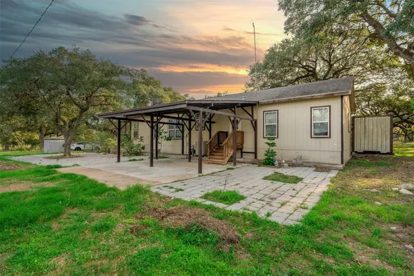 a swimming pool with trees in the background