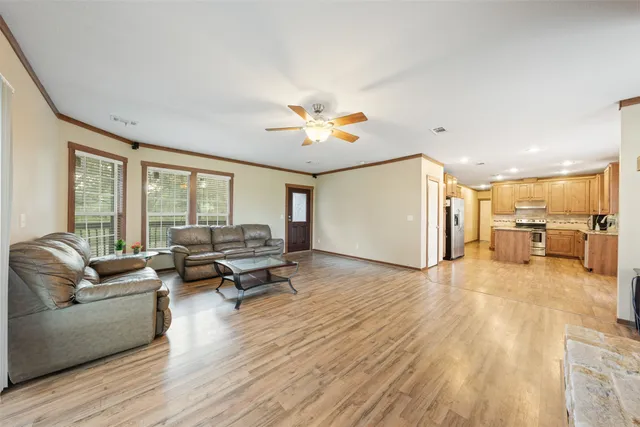 a view of a livingroom with a fireplace and window