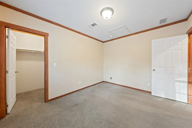 a bathroom with a granite countertop sink a mirror and a bathtub