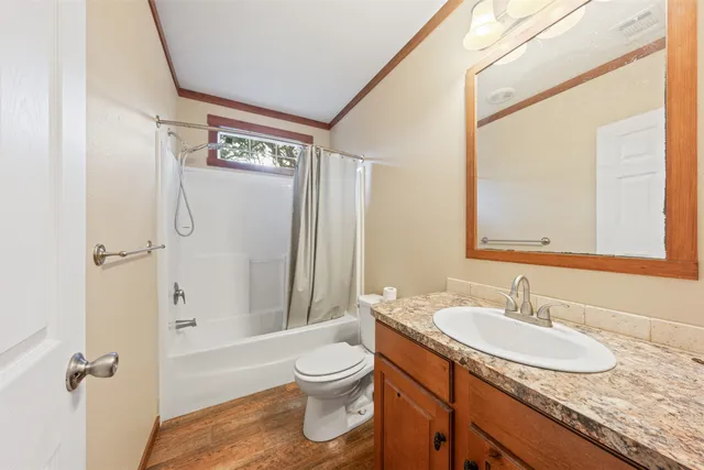 a bathroom with a tub and a window