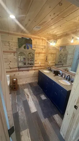 a bathroom with a toilet and shower
