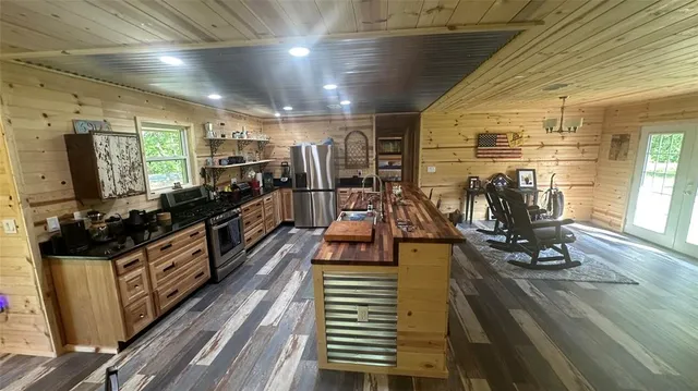 a kitchen with granite countertop a stove and a sink