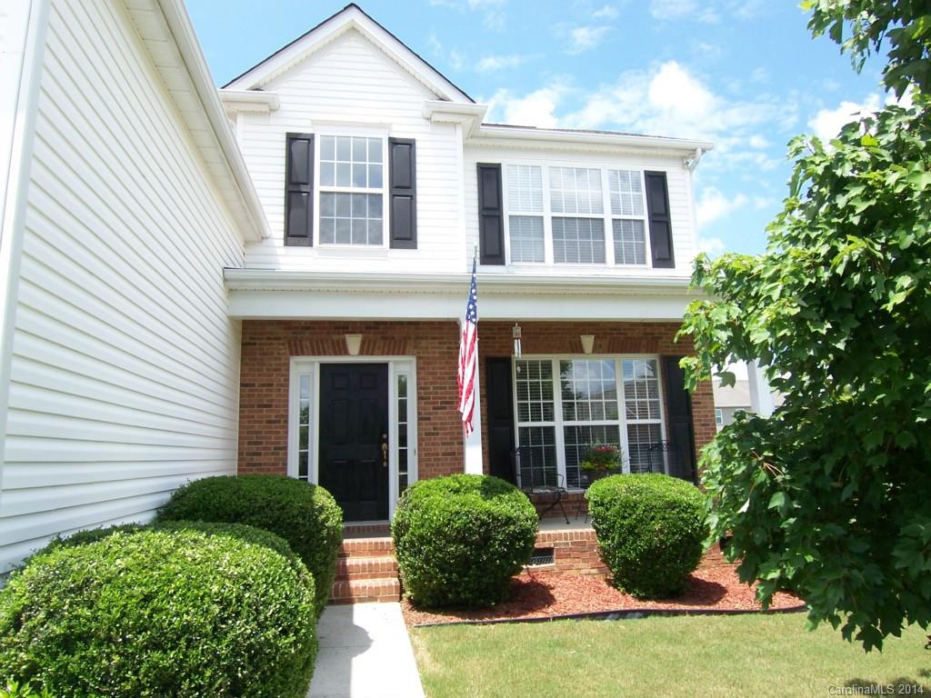 415 Lafinca Court Fort Mill, SC 29708 - Photo 2 of 17 a front view of a brick house with a yard and potted plants