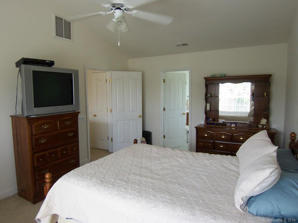 415 Lafinca Court Fort Mill, SC 29708 - Photo 11 of 17 a bedroom with a bed and a flat screen tv