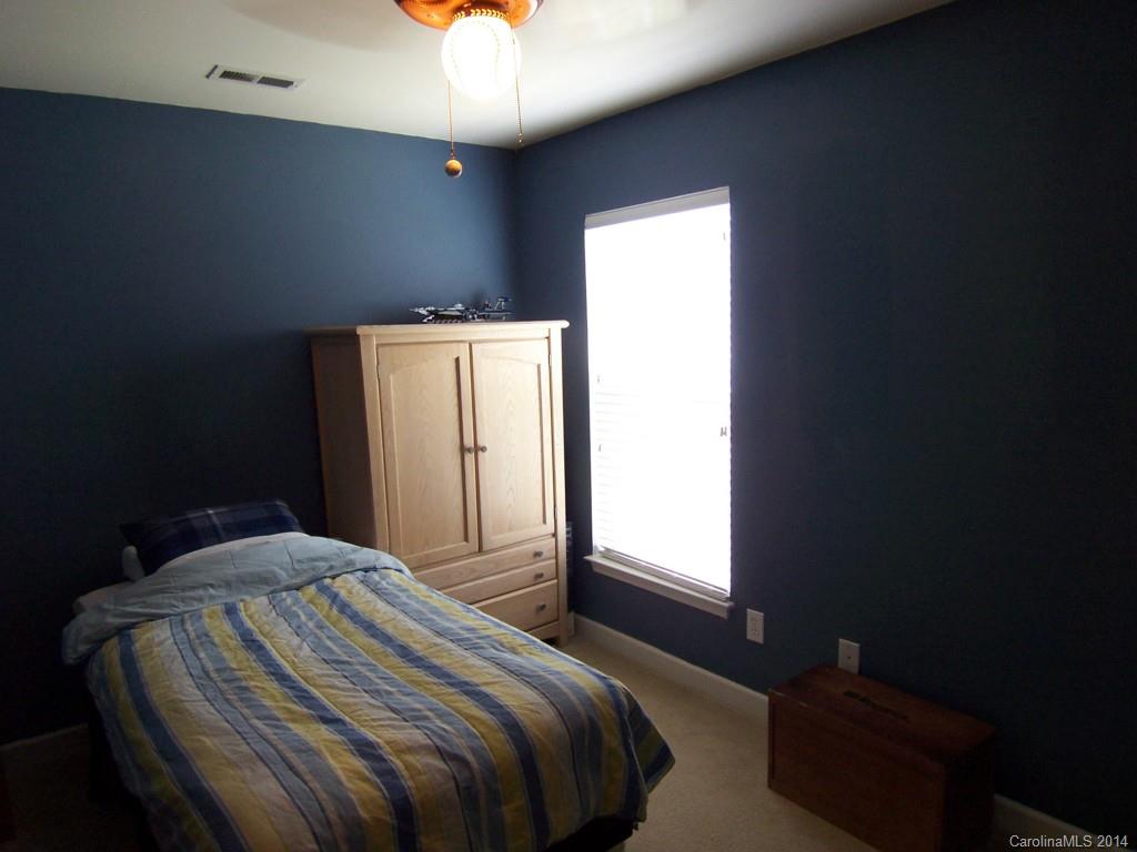 415 Lafinca Court Fort Mill, SC 29708 - Photo 14 of 17 a bedroom with a bed and a window