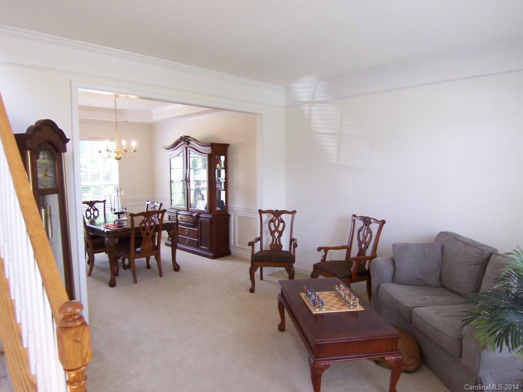 415 Lafinca Court Fort Mill, SC 29708 - Photo 4 of 17 a living room with furniture and a large mirror next to a window