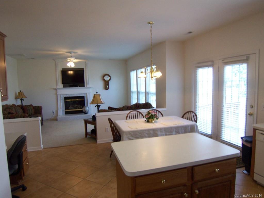 415 Lafinca Court Fort Mill, SC 29708 - Photo 6 of 17 a view of kitchen and living room with a fireplace