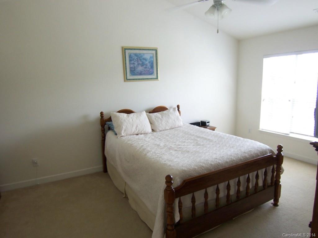 415 Lafinca Court Fort Mill, SC 29708 - Photo 10 of 17 a bedroom with a bed and a window