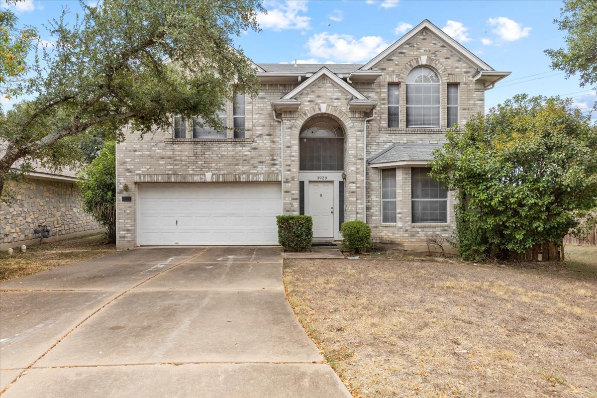 3929 Katzman Drive Austin, TX 78728 - Photo 1 of 29 View of front facade with brick siding, a garage, and concrete driveway