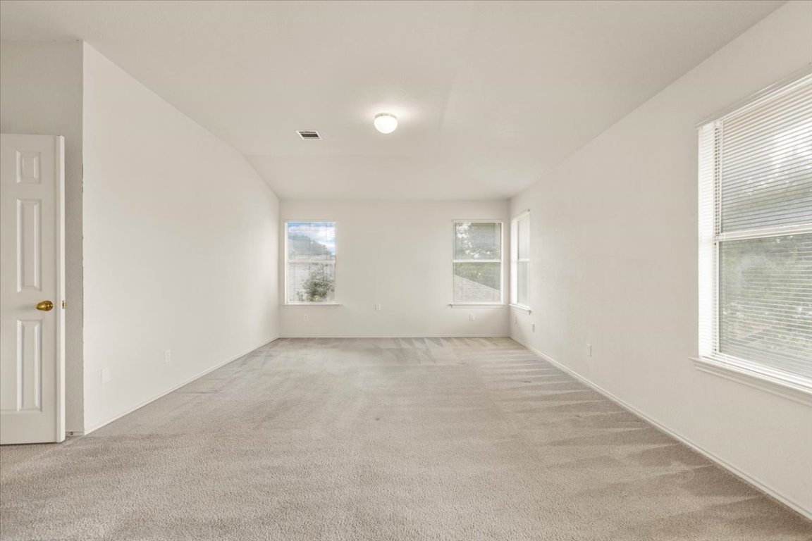 3929 Katzman Drive Austin, TX 78728 - Photo 13 of 29 an empty room with windows and closet