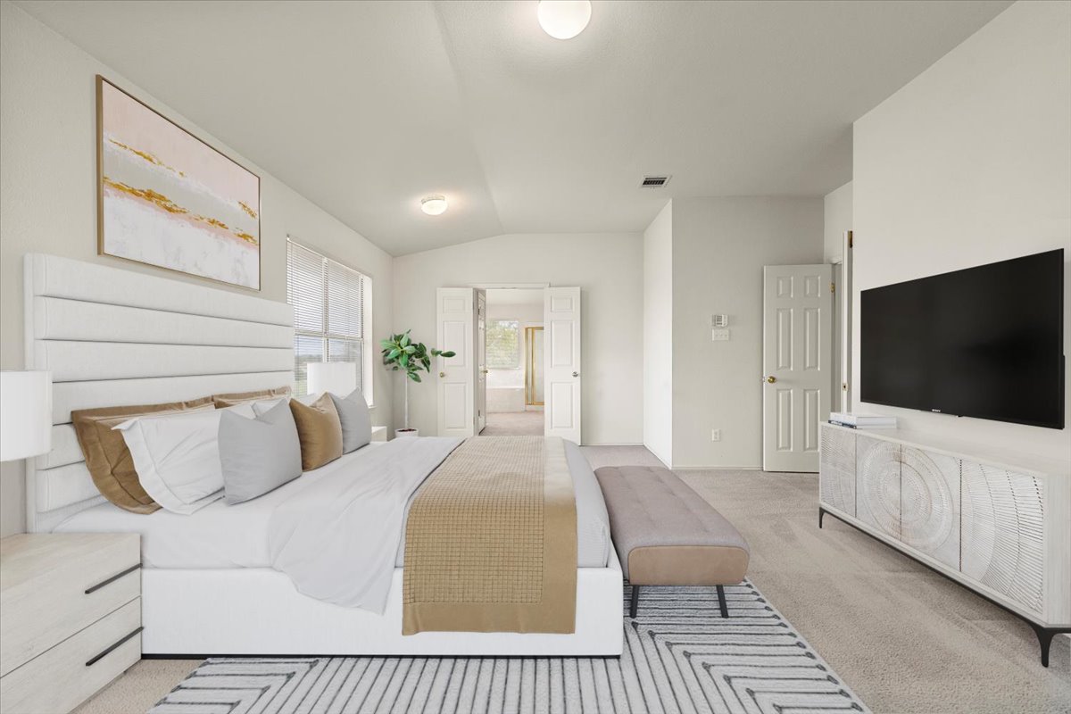 3929 Katzman Drive Austin, TX 78728 - Photo 14 of 29 Bedroom with carpet and vaulted ceiling