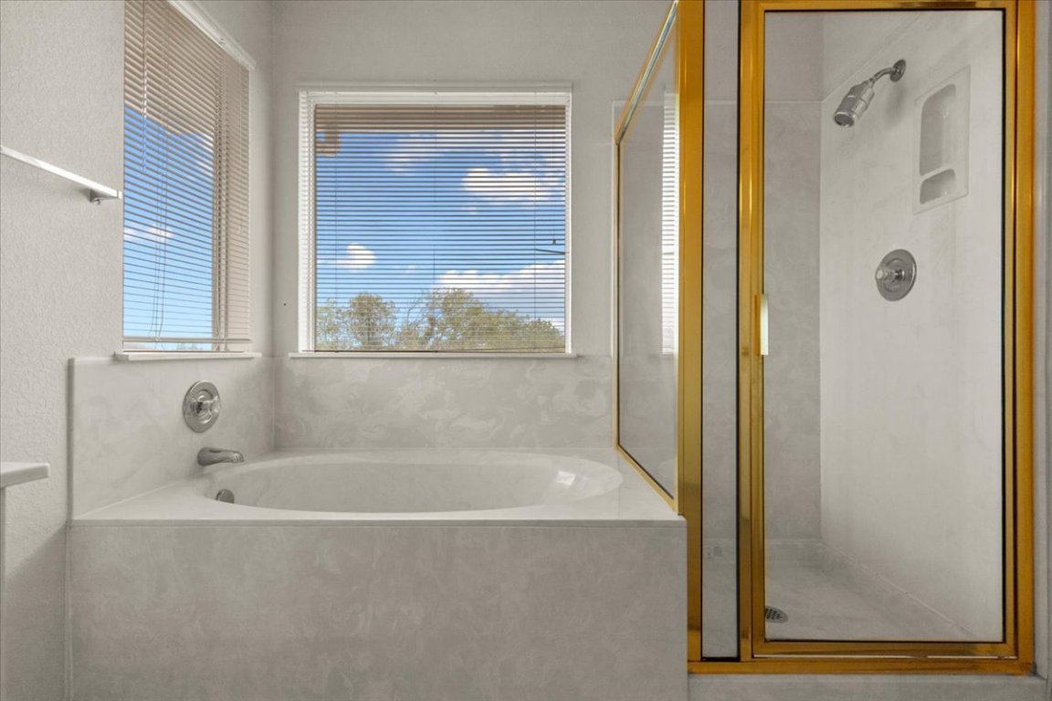 3929 Katzman Drive Austin, TX 78728 - Photo 18 of 29 a white bath tub sitting next to a window