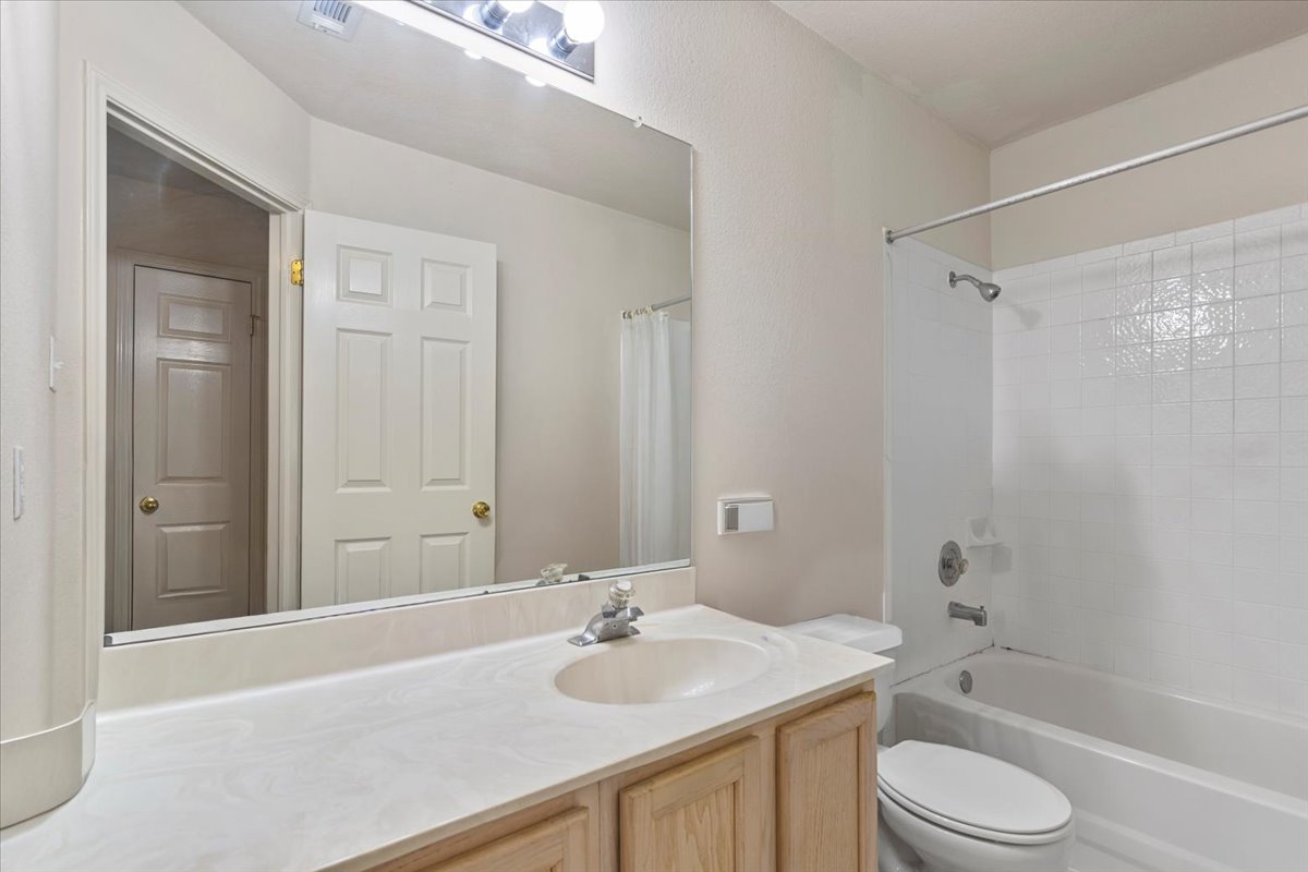 3929 Katzman Drive Austin, TX 78728 - Photo 21 of 29 Full bathroom featuring vanity and shower / bath combo