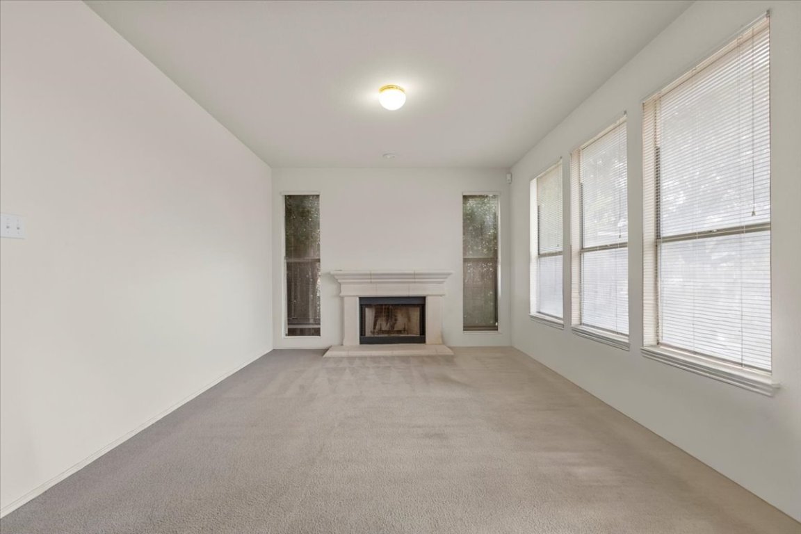 3929 Katzman Drive Austin, TX 78728 - Photo 25 of 29 a view of an empty room with a window and fireplace