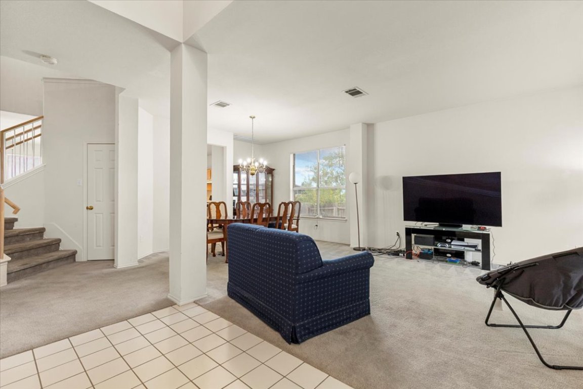3929 Katzman Drive Austin, TX 78728 - Photo 6 of 29 a living room with furniture and a flat screen tv