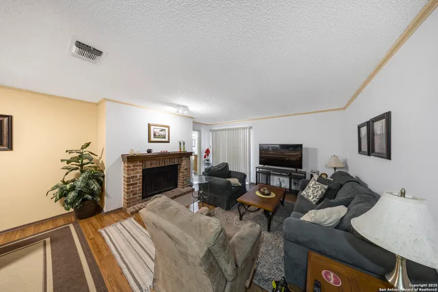 a bedroom with furniture and a flat screen tv
