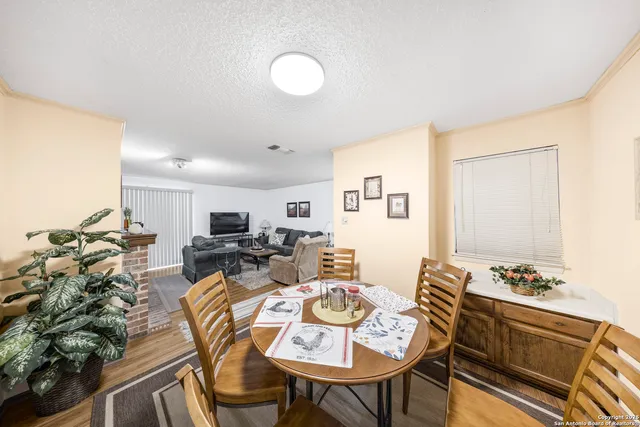 a view of a dining room with furniture